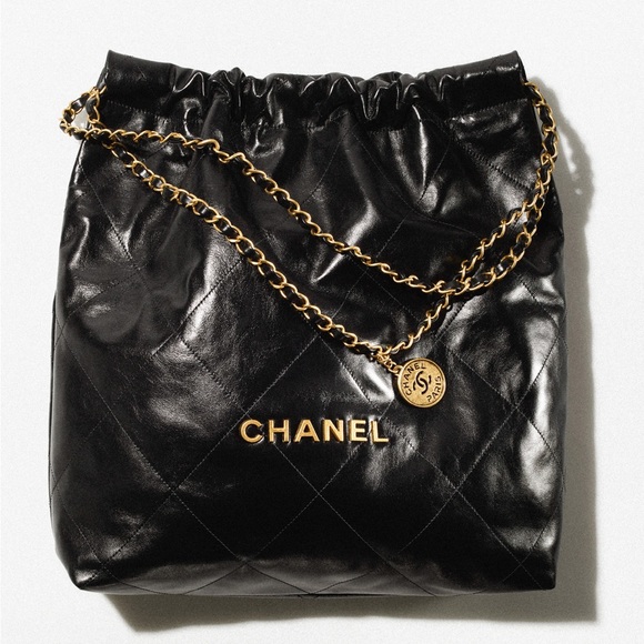 CHANEL Handbags - Chanel 22 Shiny Calfskin & Gold-Tone Metal Handbag